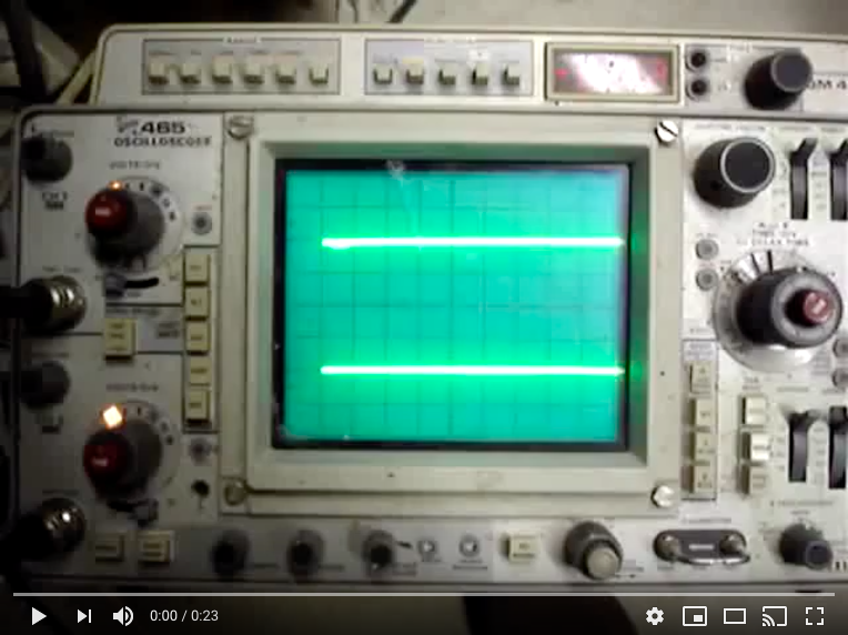 A green screen is shown on an old oscilloscope.