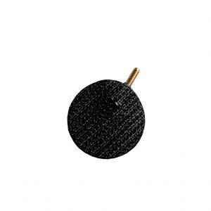 A black round object with gold handle.